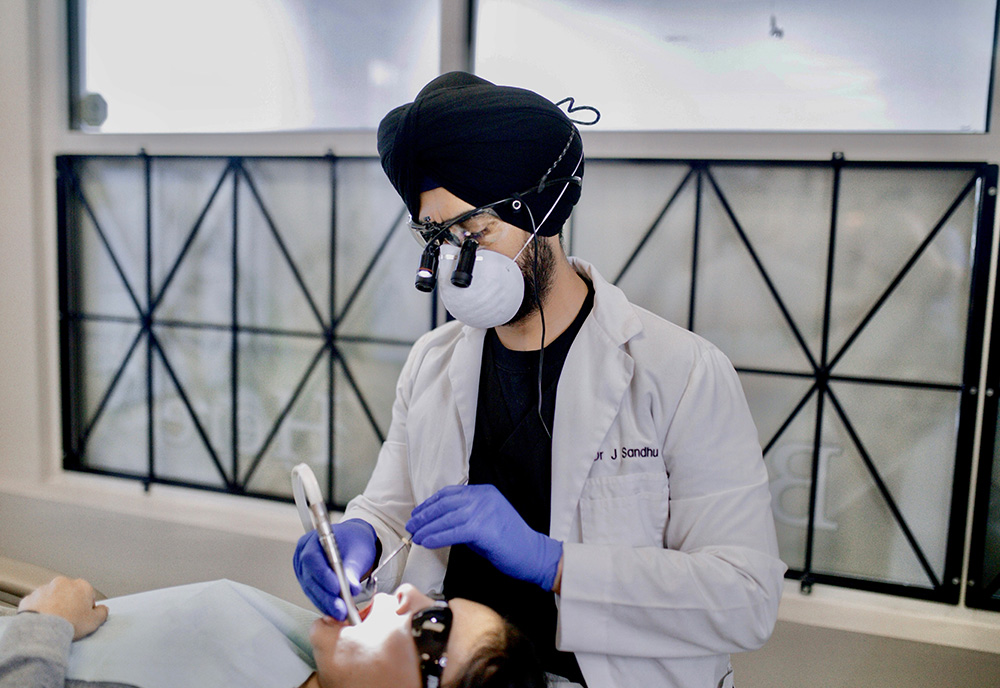 Dr. Jasdeep Sandhu Checking Patient