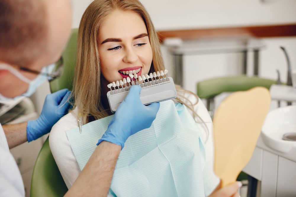 a woman is getting dental treatment.